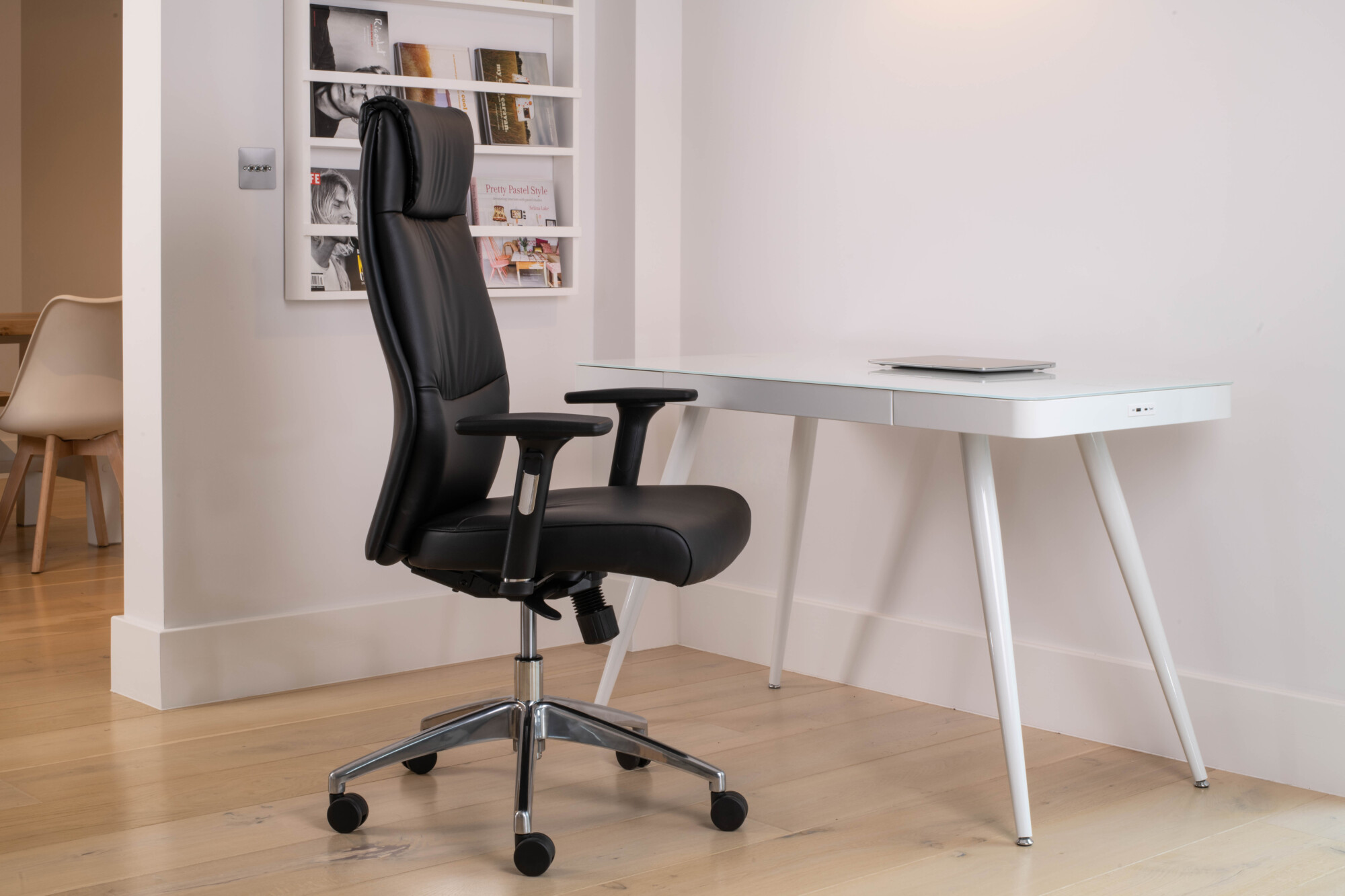 Karls's executive ergonomic chair by Koble Designs, an all-black faux leather chair. 